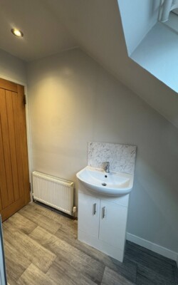 Light grey walls around small sink