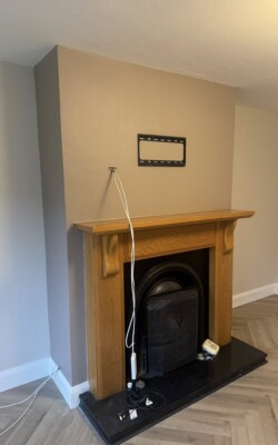 Light grey painted wall on chimney breast